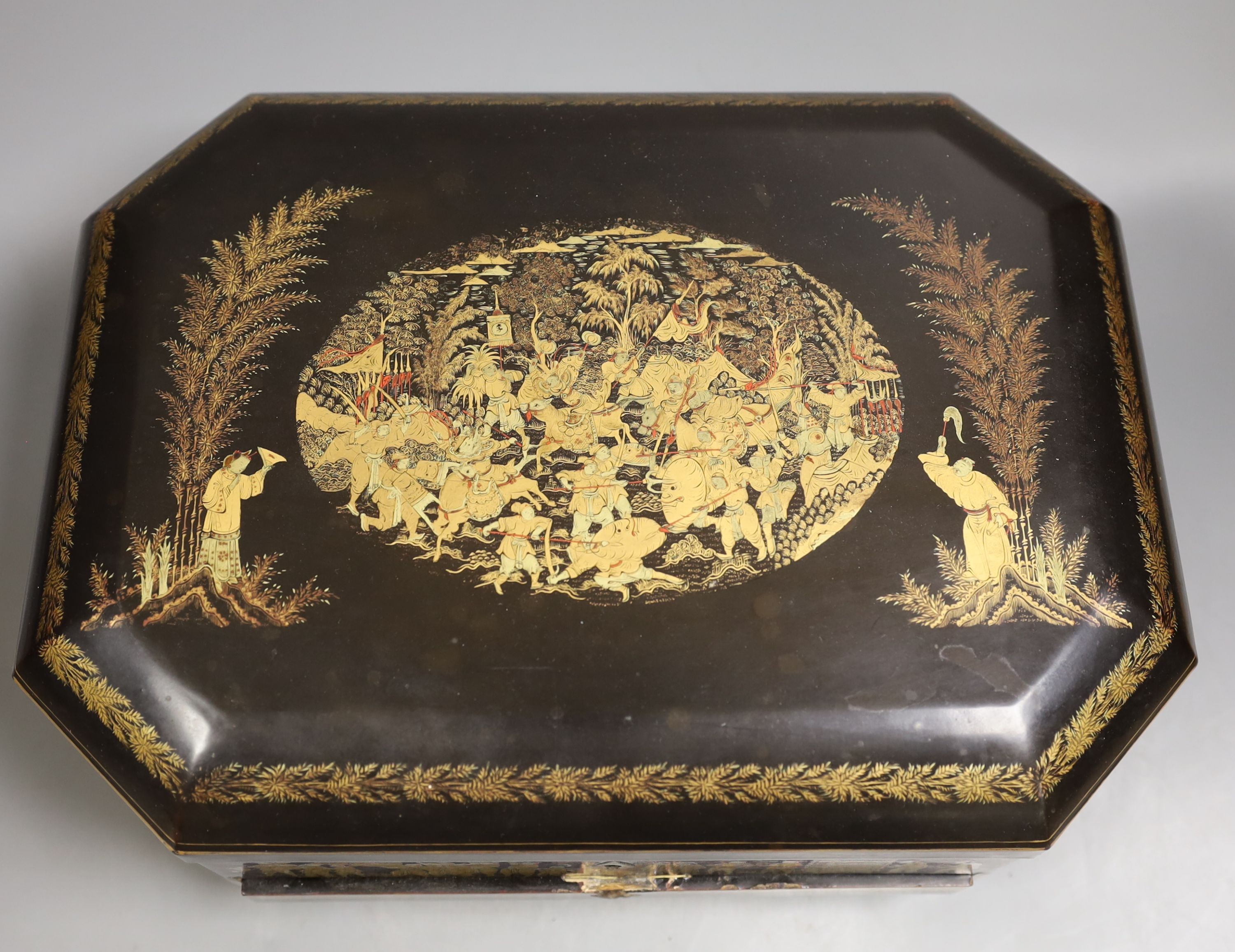 A mid 19th century Chinese Cantonese lacquer workbox with with carved Ivory sewing accessories to the interior, 37cm wide